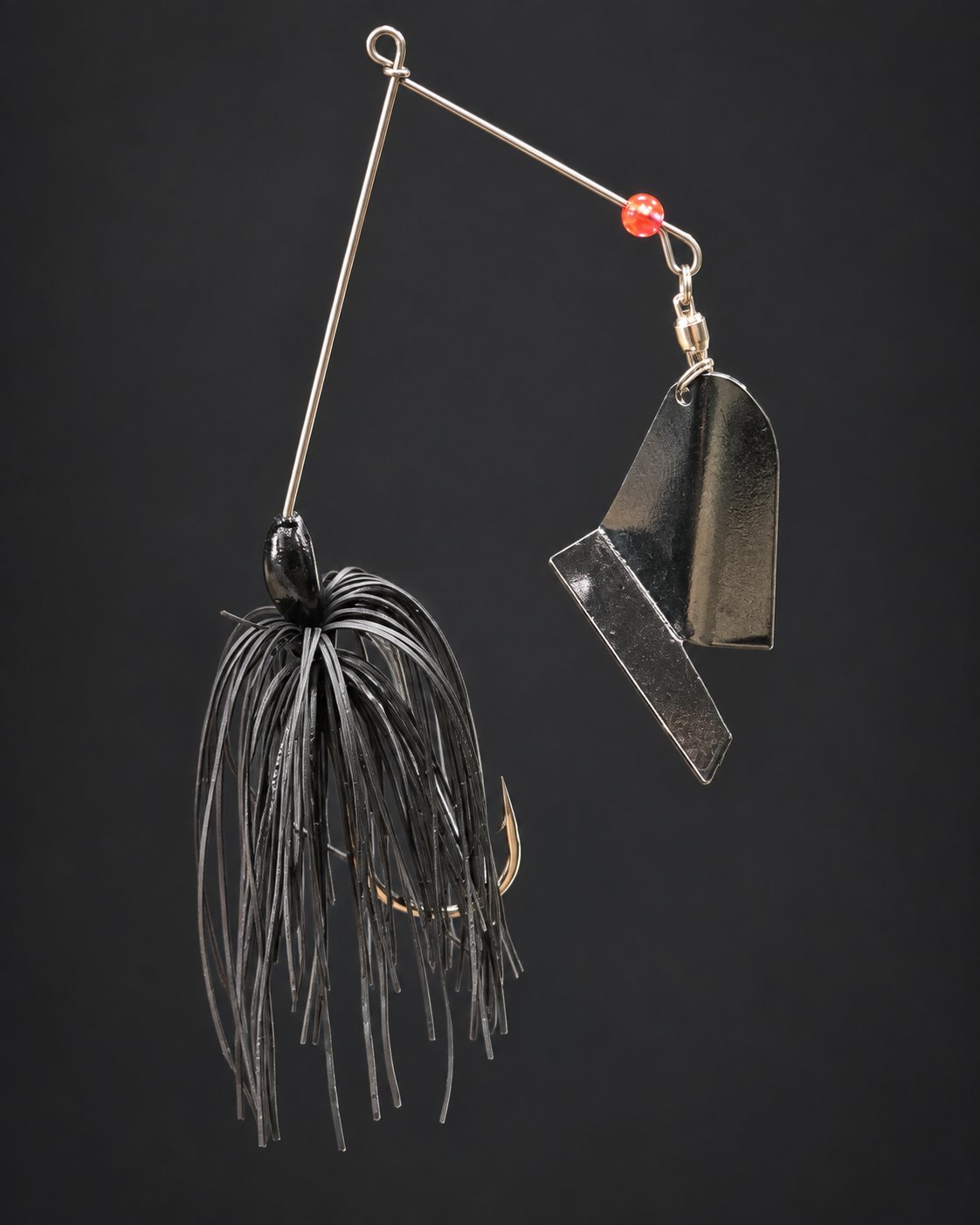 Black Kitchen Sink suspended from its wire, showing its skirt and folded dark metal blade.