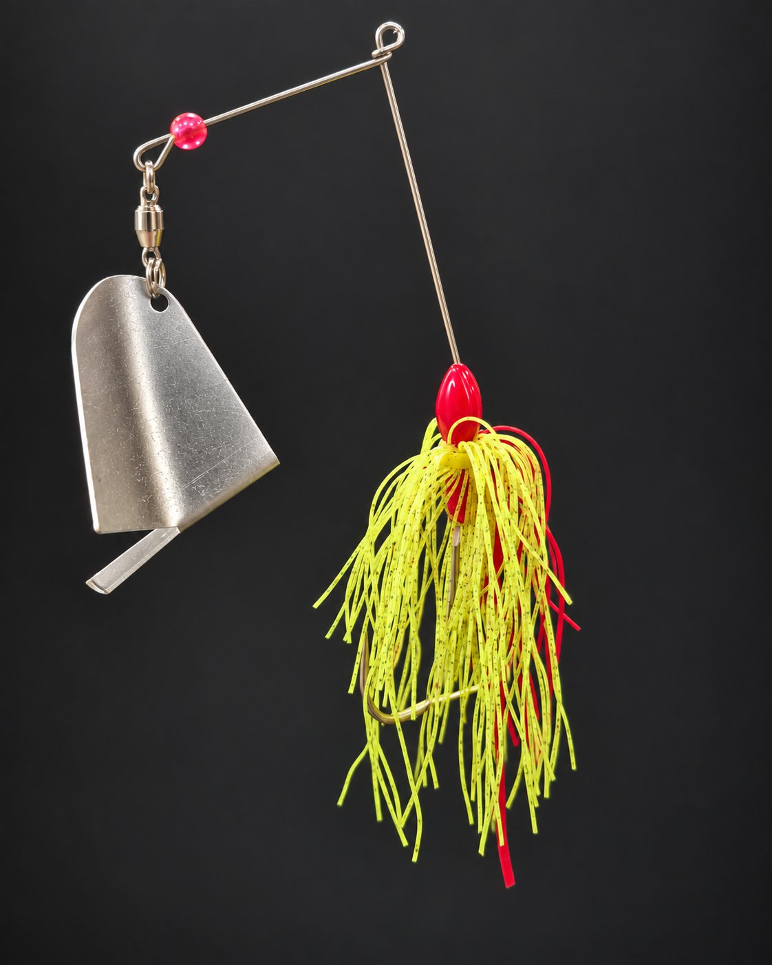 Kitchen Sink with a red head, a chartreuse and red skirt and a folded silver-colored blade.