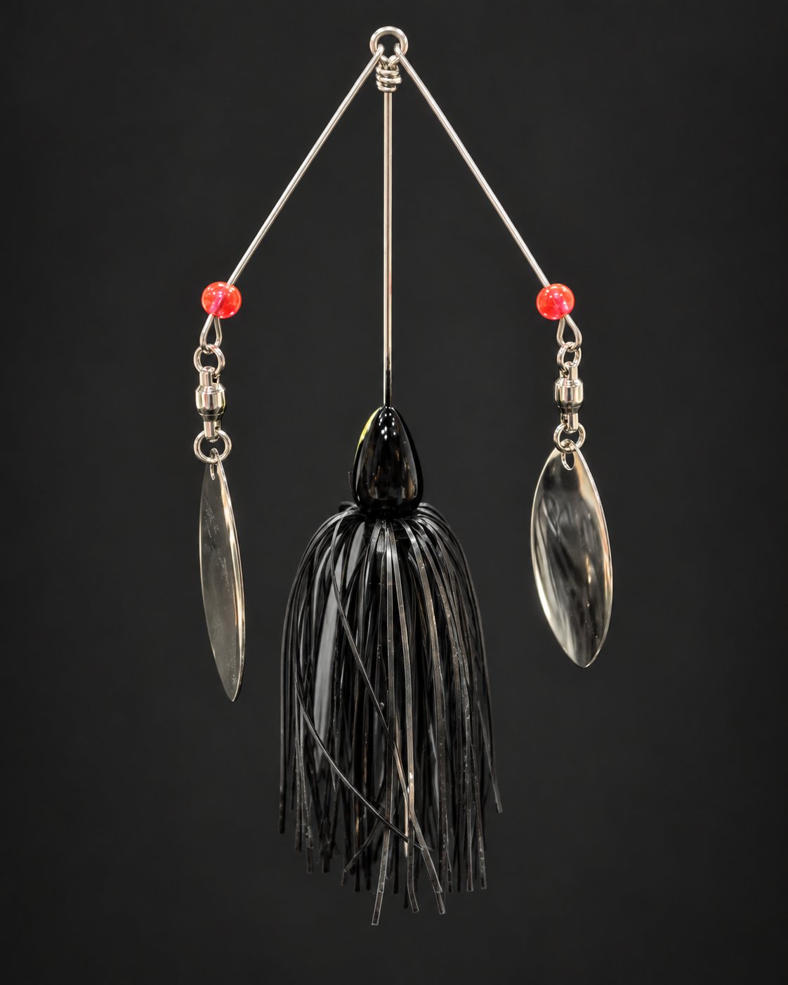 Dark-skirted double-arm spinnerbait photographed with both blades seen at an angle.