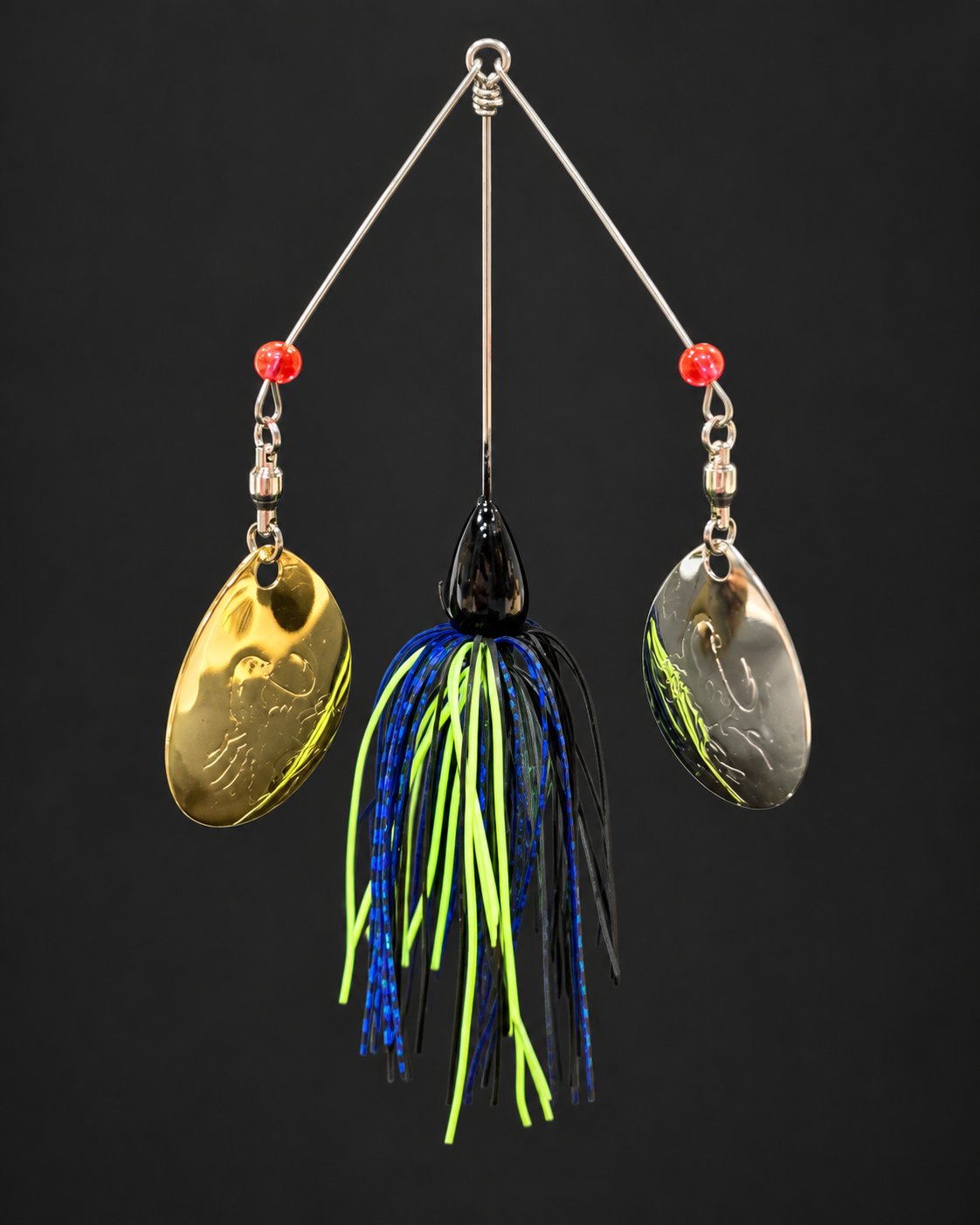 Double-arm spinnerbait with a black head, blue, chartreuse and black skirt, and gold and silver-colored blades.